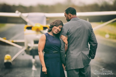 Wedding couple off to the honeymoon airplane photo shoot